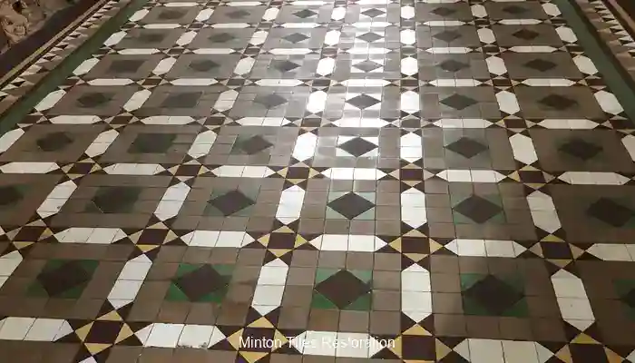 Victorian Minton tile floor with dull worn areas and ingrained soil