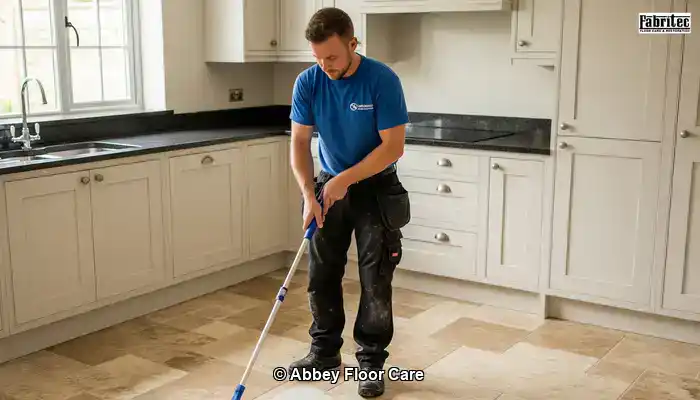 Sealer being applied evenly to a clean travertine floor